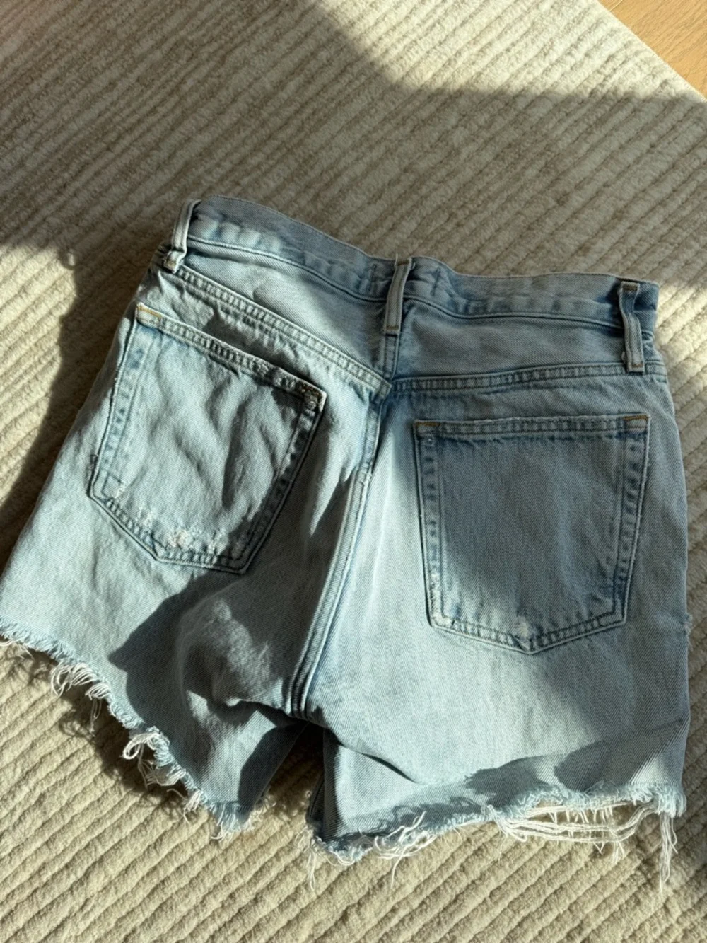 Agolde Riley Distressed High-Rise Light Blue Denim Shorts - Picture 5 of 5